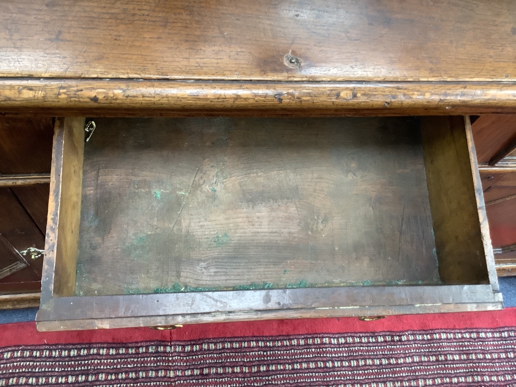 An 18th century oak low dresser, width 182cm depth 47cm height 89cm